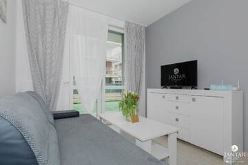 Фото номера Апартаменты с 1 спальней и видом на сад (4 взрослых) Апартаменты Jantar Apartamenty - Port Rybacki г. Колобжег 37