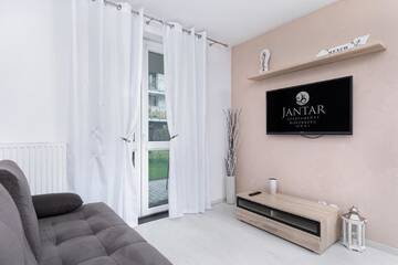 Фото номера Апартаменты с видом на сад Апартаменты Jantar Apartamenty - Port Rybacki г. Колобжег 16