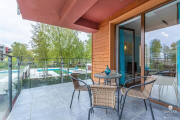 Фото номера Апартаменты с видом на бассейн Апартаменты Jantar Apartamenty - Family Vacation Polanki г. Колобжег 6