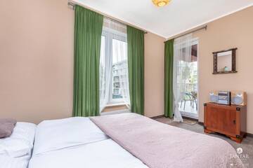 Фото номера Апартаменты с видом на бассейн Апартаменты Jantar Apartamenty - Family Vacation Polanki г. Колобжег 7