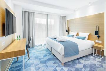 Фото номера Улучшенный двухместный номер с 1 кроватью Отель Seaside Park Hotel г. Колобжег 3